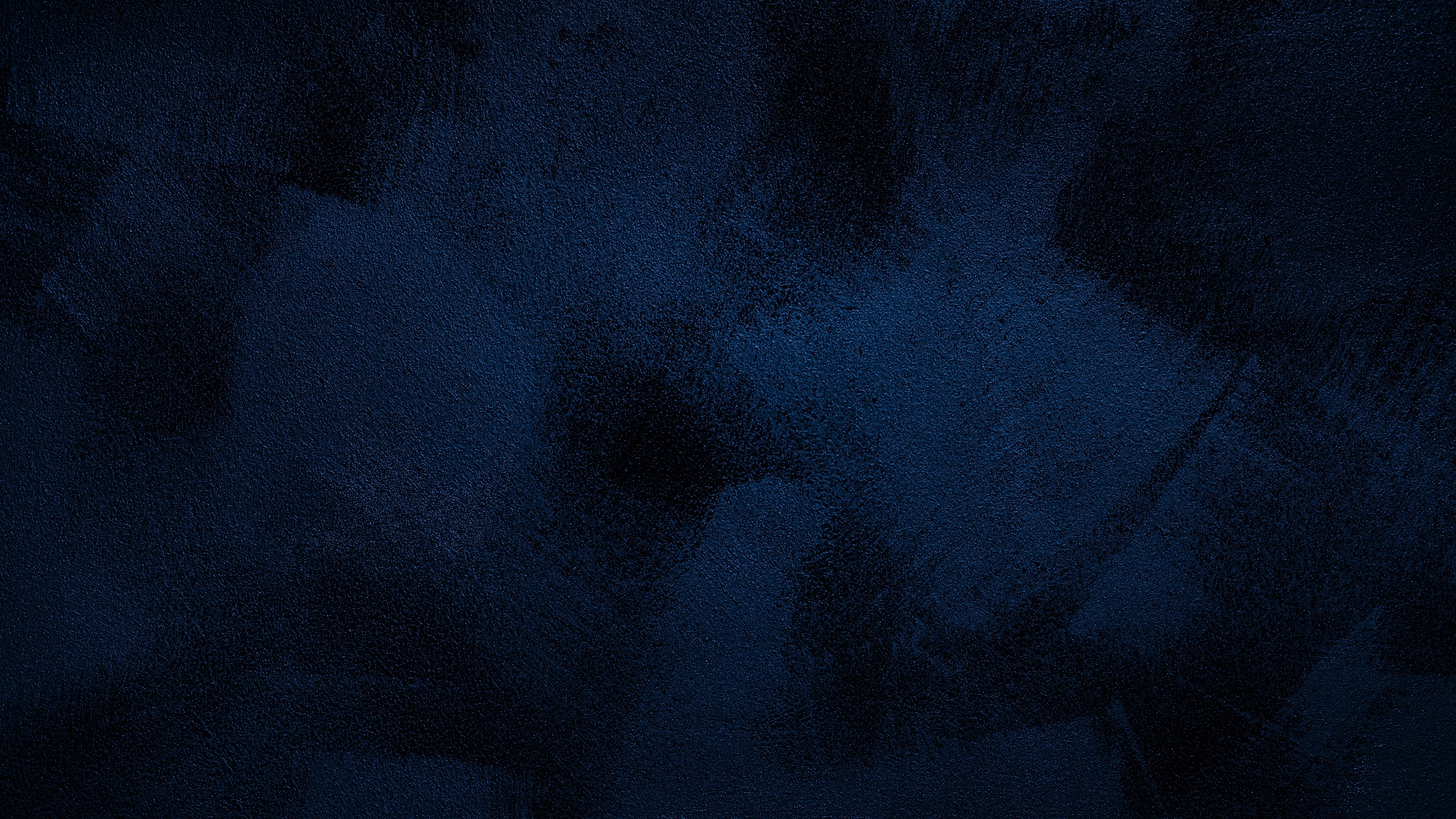 Smiling woman with wavy hair and warm expression