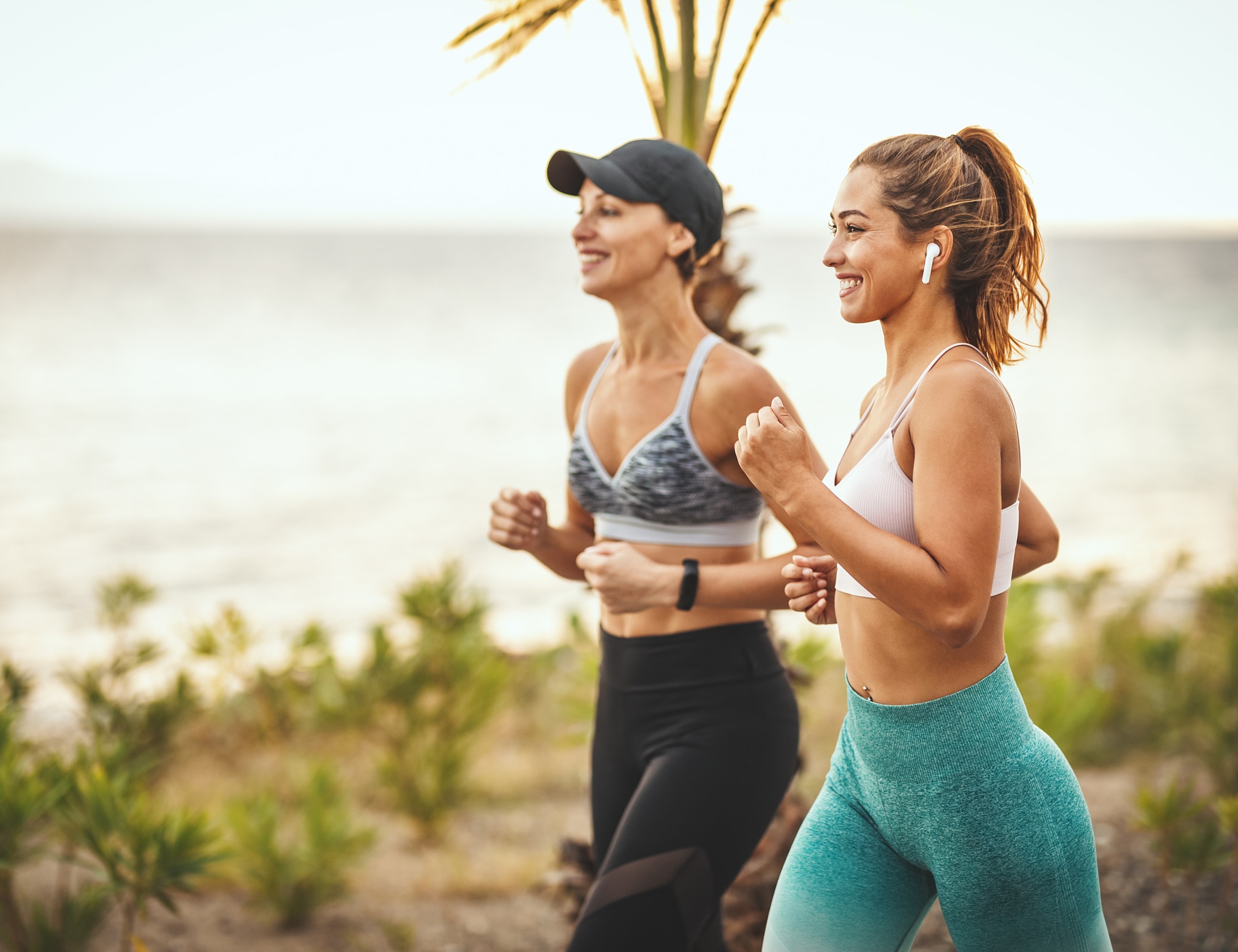 Hunt Valley IV Therapy models jogging by the beach.
